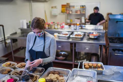 Volunteer cooking in the kitchen 