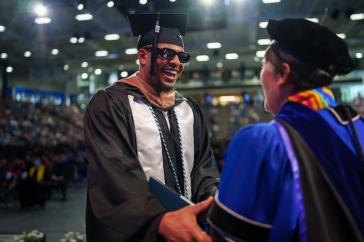 Student accepting diploma