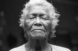 elderly woman with eyes closed