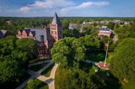 Aerial shot of UNH campus in summer, with T Hall in center