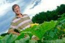 UNH professor emeritus J. Brent Loy with Slick Pik summer squash