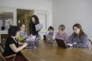 Faculty and staff at the University of New Hampshire libraries around a table