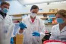 A photo of Marie Carlota Dao (center) with research students Brandy Moser (left) and Jason Hansen.