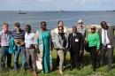 A photo of a group of people set against the backdrop of the Gulf of Maine